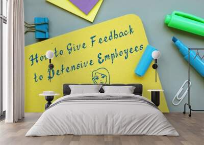 Career concept about How to Give Feedback to Defensive Employees with inscription on the page. Wall mural