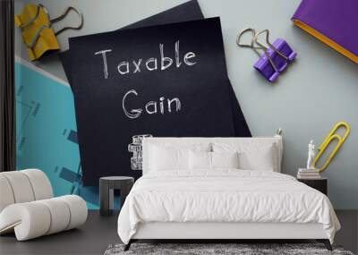 Financial concept meaning Taxable Gain with sign on the page. Wall mural