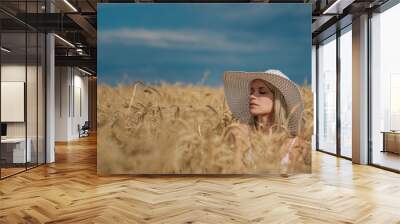 nature, summer holidays, vacation and people concept - face of happy smiling woman or teenage girl n in hat on cereal field Wall mural