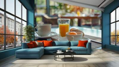 Morning breakfast setting in hotel restaurant with coffee and fresh orange juice Wall mural