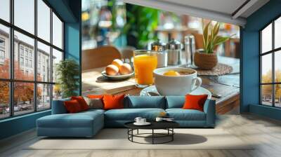 Morning breakfast setting with coffee, fresh orange juice, and eggs in hotel restaurant Wall mural