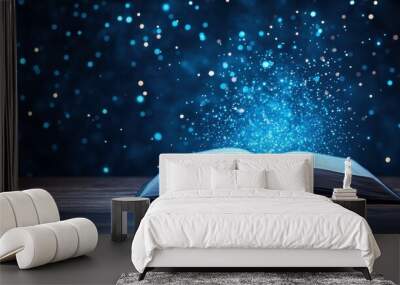 Open book from which blue lights fly, symbolizing the great power of science and knowledge. Wall mural