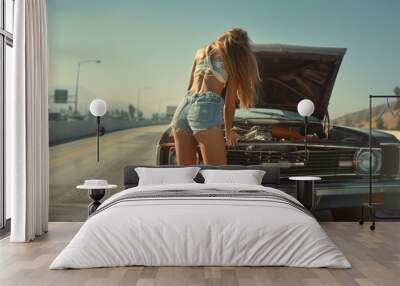 A young woman in casual summer attire is upset over her broken down car on a highway. She tries to fix the engine herself, feeling frustrated by the unexpected stop on her road trip Wall mural