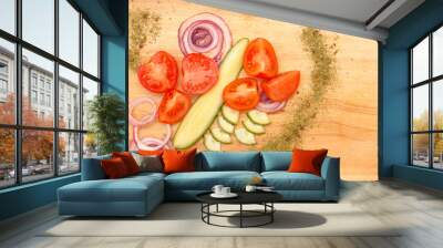 Beautifully arranged tomatoes with cucumbers and red onions on a wooden board Wall mural