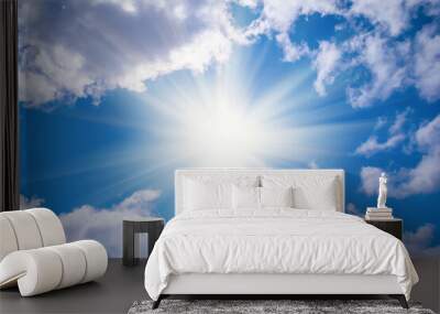 sparkle sun on the blue sky among dense clouds, concept natural background Wall mural