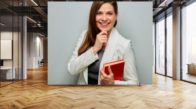 Accountant woman with red book isolated portrait. Wall mural