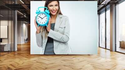 Business woman hold watch. Time concept. Smiling girl portrait, Wall mural