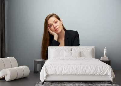 Smiling business woman in black suit sitting on chair isolated portrait with copy space. Wall mural