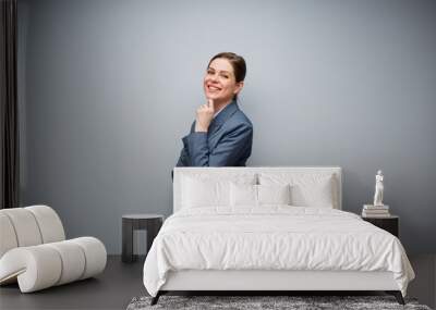 Smiling business woman in gray suit isolated portrait with copy space. Wall mural