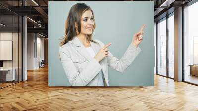 smiling business woman showing hand. copy space. Wall mural