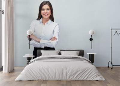 studio portrait of smiling positive business woman. Wall mural