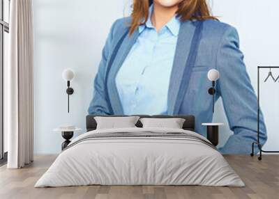 Toothy smiling business woman wearing a building helmet Wall mural