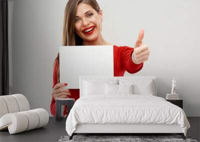 woman holding sign board with copy space doing thumb up. Wall mural