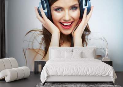 Young Happy Music woman isolated portrait. Female model studio Wall mural