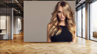 Blond woman with long curly beautiful hair. Wall mural