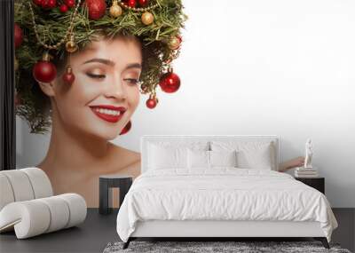 Cute girl with christmas wreath on her head. Isolated on white background. Wall mural