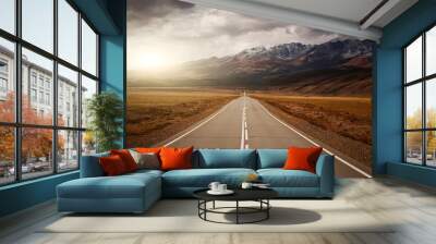 Rural empty road. Mountains and sunset at background. Wall mural