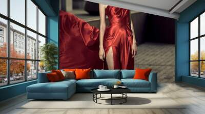 Sexy young beauty woman in fluttering red dress Wall mural