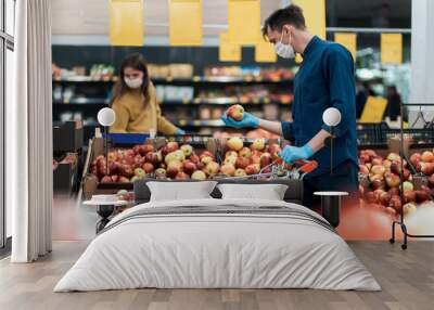 customers wearing protective masks keep their distance during the quarantine period Wall mural