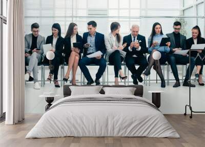 group of employees using their devices in the conference room. Wall mural