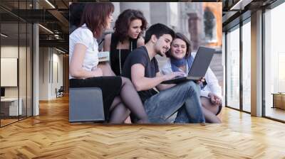 group of fellow students with books and laptop Wall mural