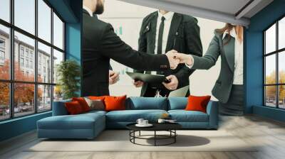 handshake of business partners after signing the contract in the Wall mural