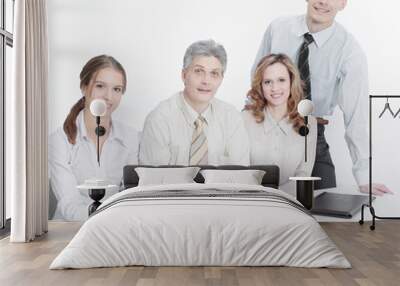 portrait of successful business team sitting behind a Desk Wall mural