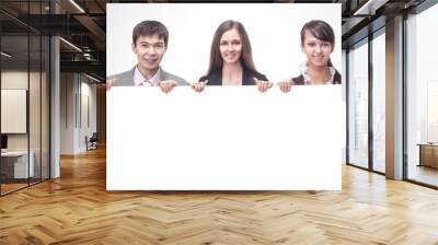 successful business team holding a blank banner. Wall mural