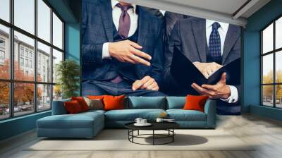 two businessmen discussing the terms of the contract . Wall mural