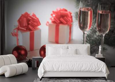 two glasses with champagne and Christmas gifts at the Christmas Wall mural