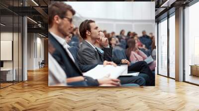 young business people listening to a lecture in the conference hall. Wall mural