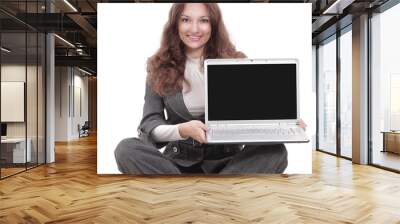 young business woman showing a laptop sitting on the floor Wall mural