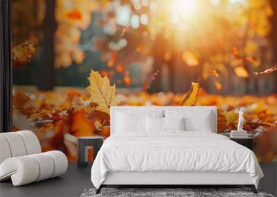 Orange fall leaves in a park, creating a sunny autumn natural background. Wall mural