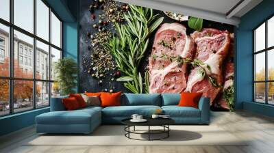 Raw pork meat garnished with fresh herbs, ready for preparation. Wall mural