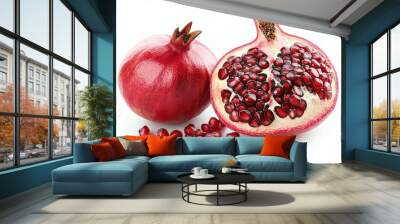 Ripe fresh pomegranate fruit, sliced to reveal its vibrant red seeds, is showcased against a white background. Wall mural