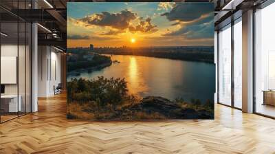 Sunset over the Dnipro River, with the evening water reflecting the last golden rays of the sun. Wall mural