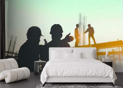 Silhouette engineer standing orders for construction crews to wo Wall mural