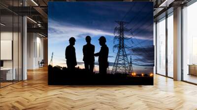 silhouette man of engineers standing at electricity station over Wall mural