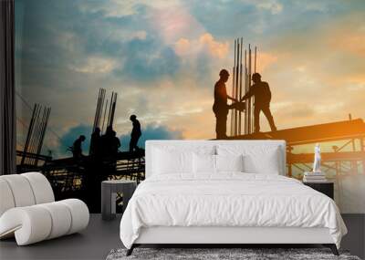 silhouette of engineer and construction team working at site over blurred background sunset pastel f Wall mural