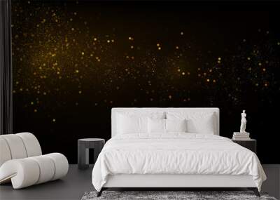 Glowing golden particles on black background Wall mural