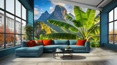 Banana plant with mountains in the background Wall mural