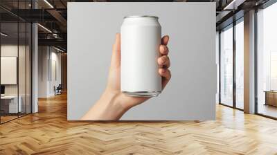 A hand holding a blank white can mockup Wall mural