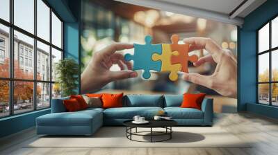 Closeup of hands connecting two puzzle pieces together on office background Wall mural