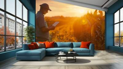 male farmer hand using tablet in corn field with to keep digital tax record Wall mural