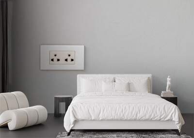 The white electrical plug socket  on a gray concrete wall. Wall mural