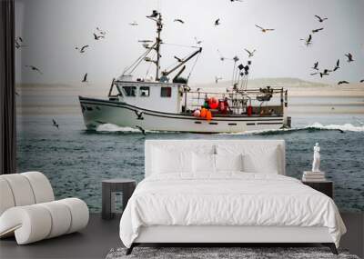 Seagulls engulf a fishing boat on the water Wall mural