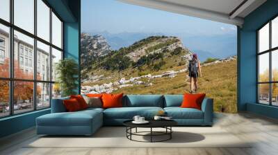 Woman hiking the Chartreuse moutains, in the French Alps, near the Dent de Crolles, Grenoble  Wall mural