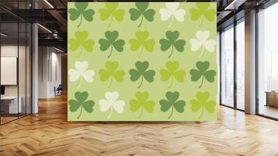 Saint Patrick's Day greetings with tree leaf clovers on green background. Wall mural