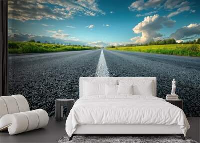 Asphalt Road Leading Towards a Sunny Sky Wall mural