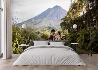 couple hiking in costa rica around volcano Wall mural